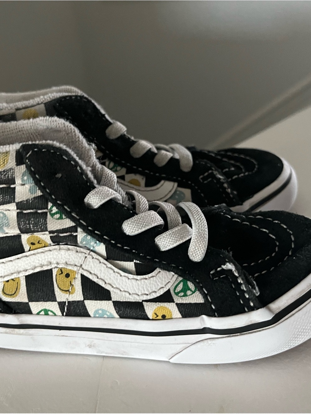Vans Kids Black Checkerboard Sneakers with Yellow Smiley & Green Peace Signs